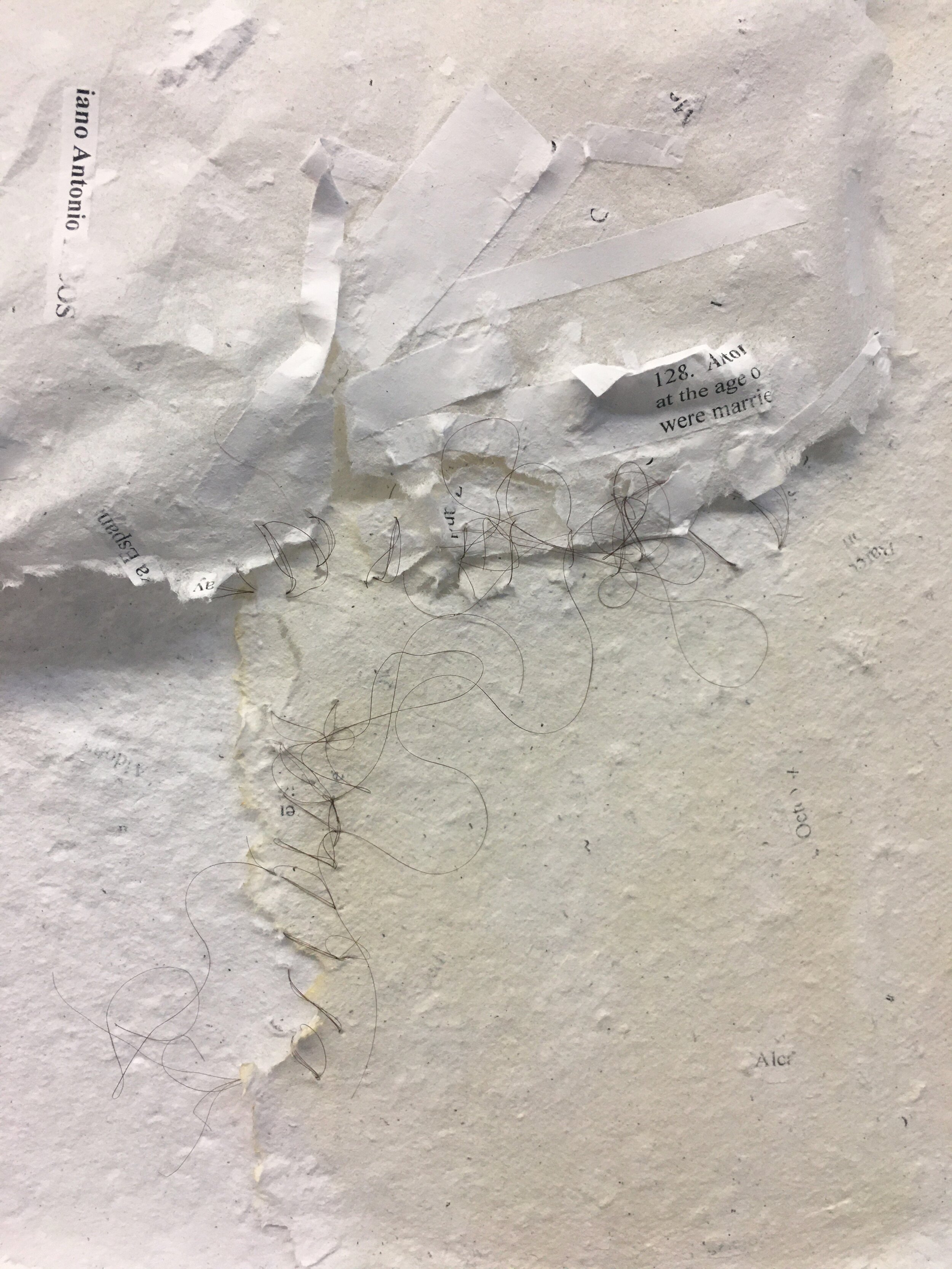 Detail of my hair stitching the reconstructed pages together