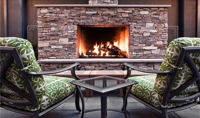 Outdoor fireplace with seating at Escala