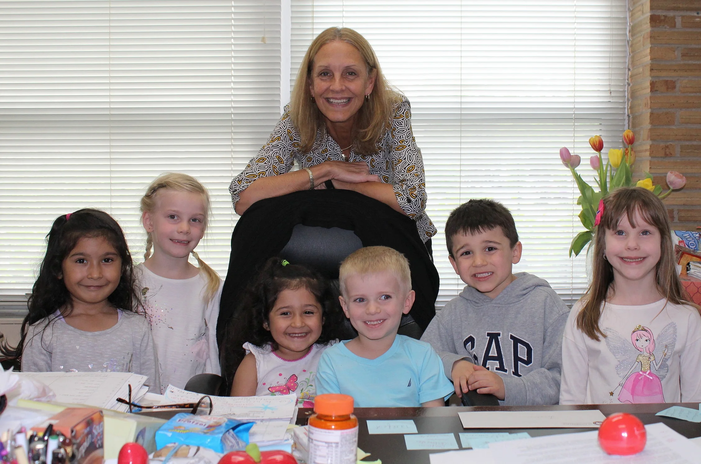 Principal Eva Panczyk with some Pre-K students at the end of a fun day!