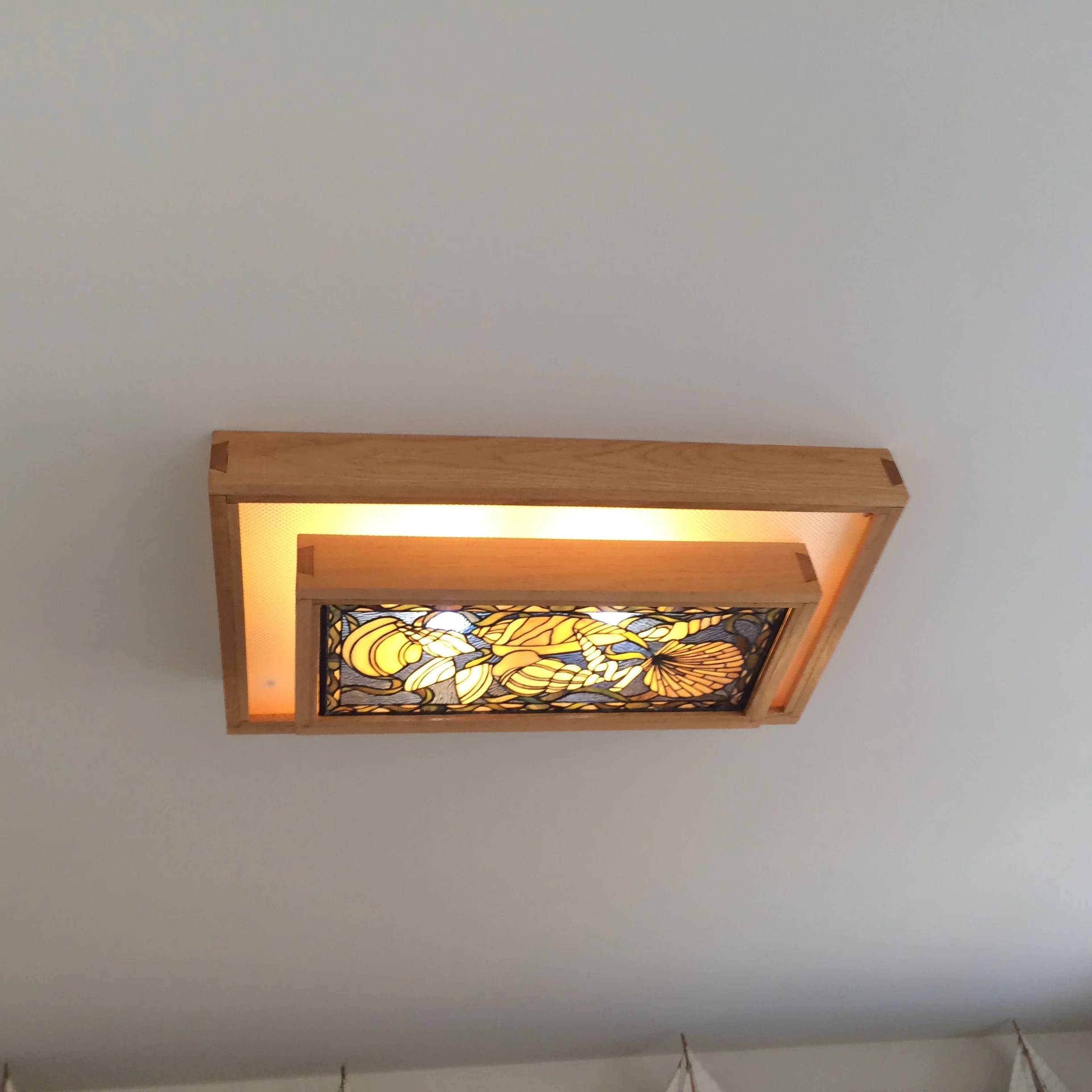 Hand carved dovetails with floating light.JPG