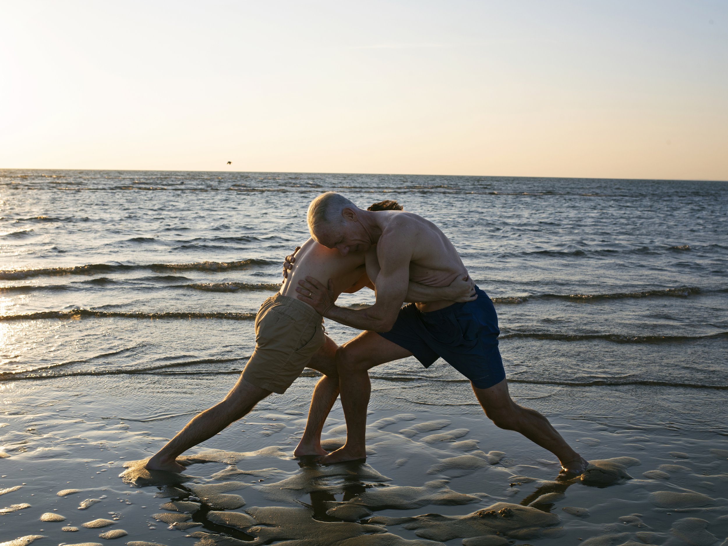 Douglas and Dad Wrestling in the Bay