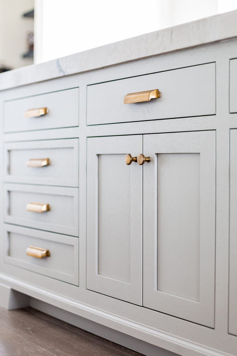 gray-shaker-cabinets-and-drawers-brass-bin-pulls-and-knobs.jpg