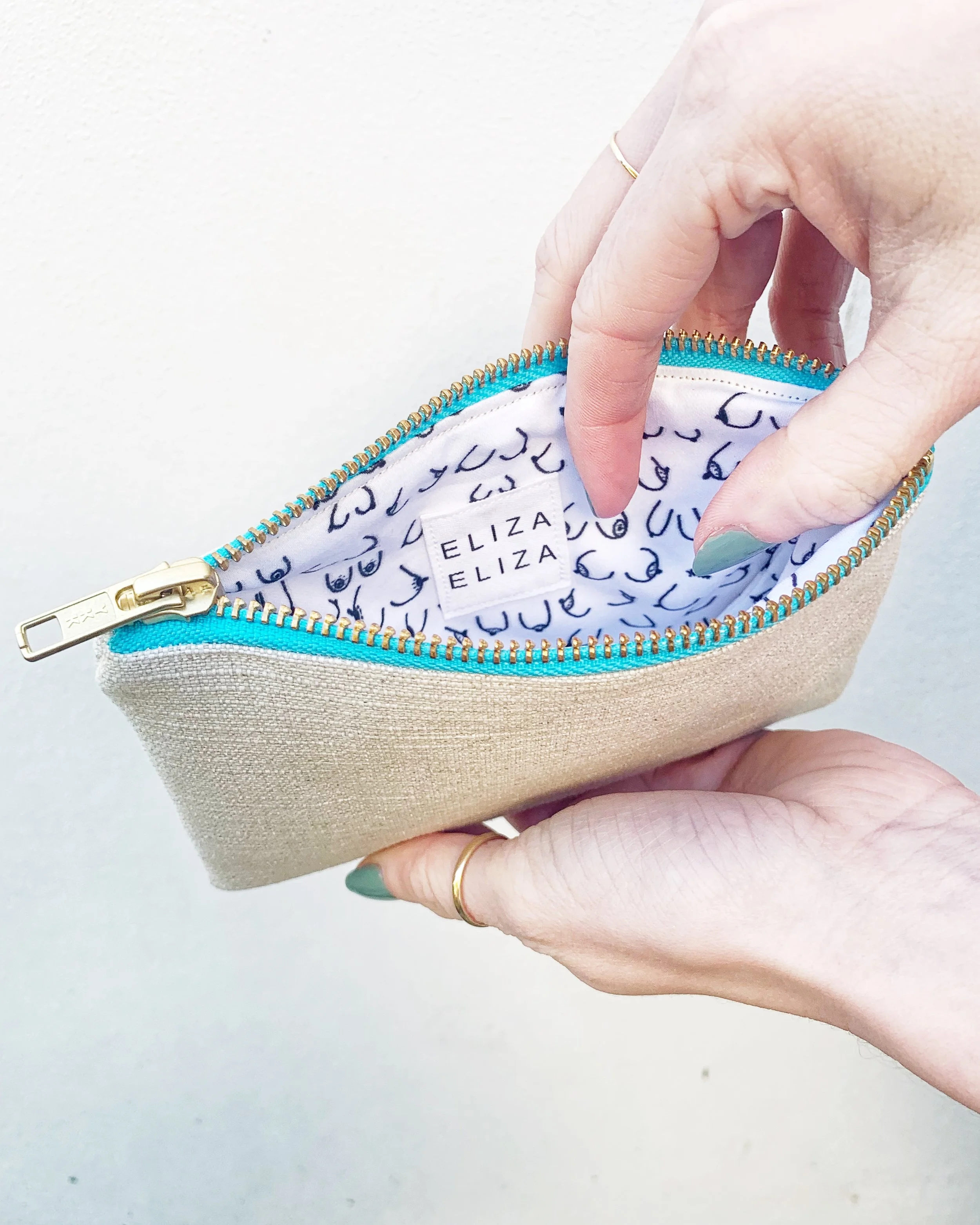 B Collection organic hemp cotton purse teal zip being help open to show lining