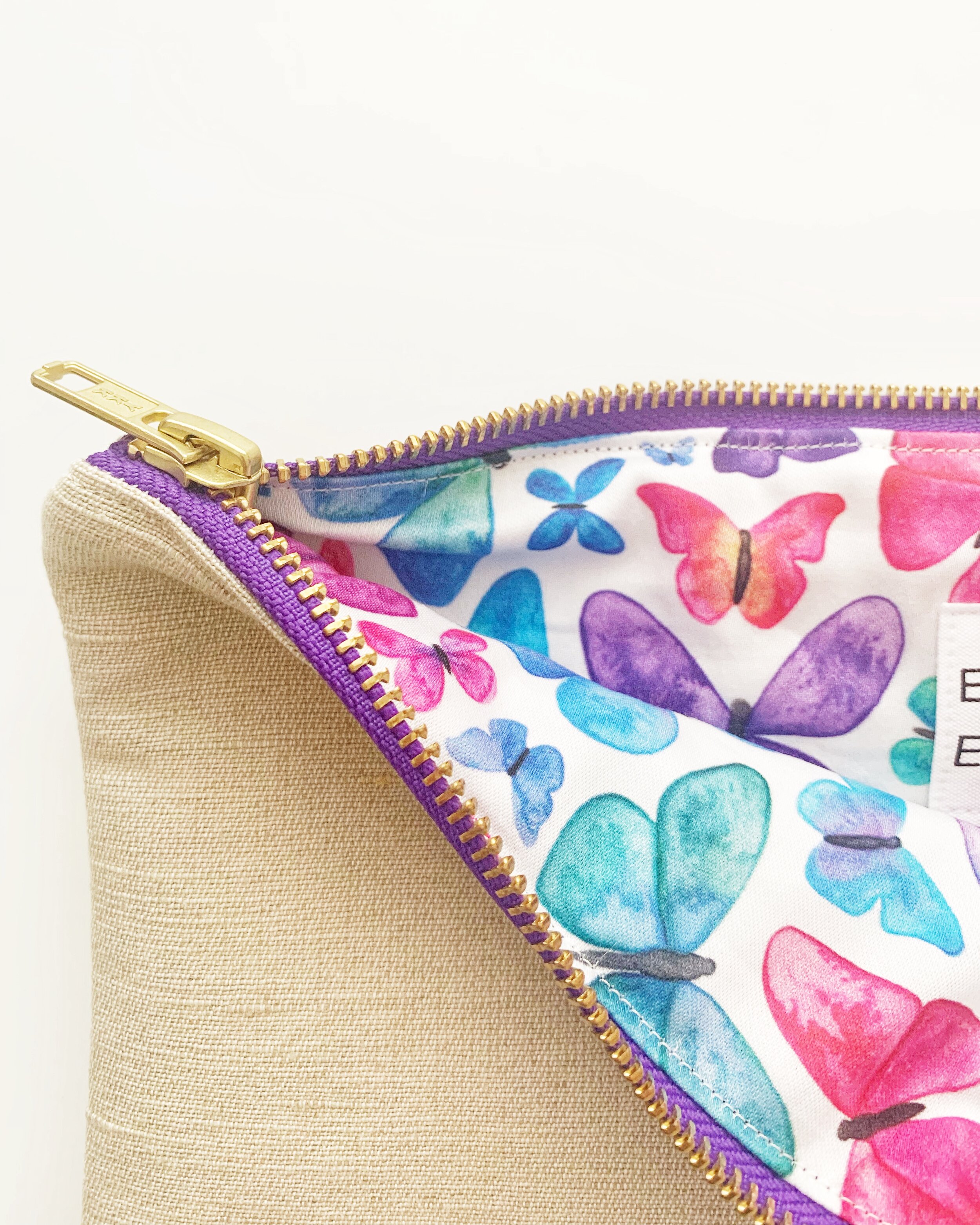 Butterfly lining of Freedom Collection clutch bag purple ykk zip