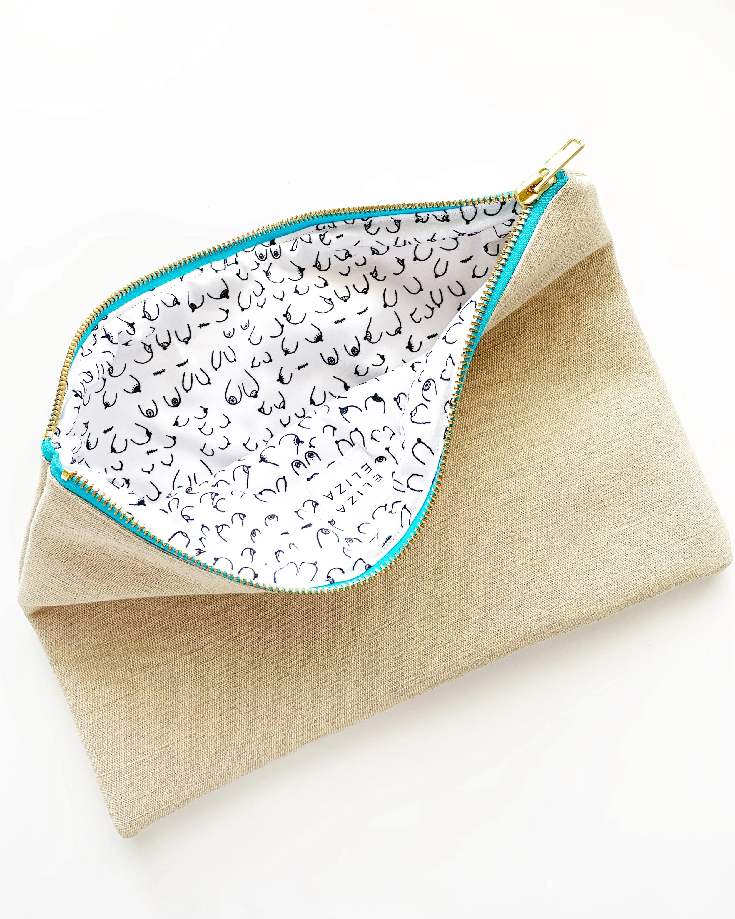 B Collection Large Clutch Bag open to show lining breast cancer awareness teal zip