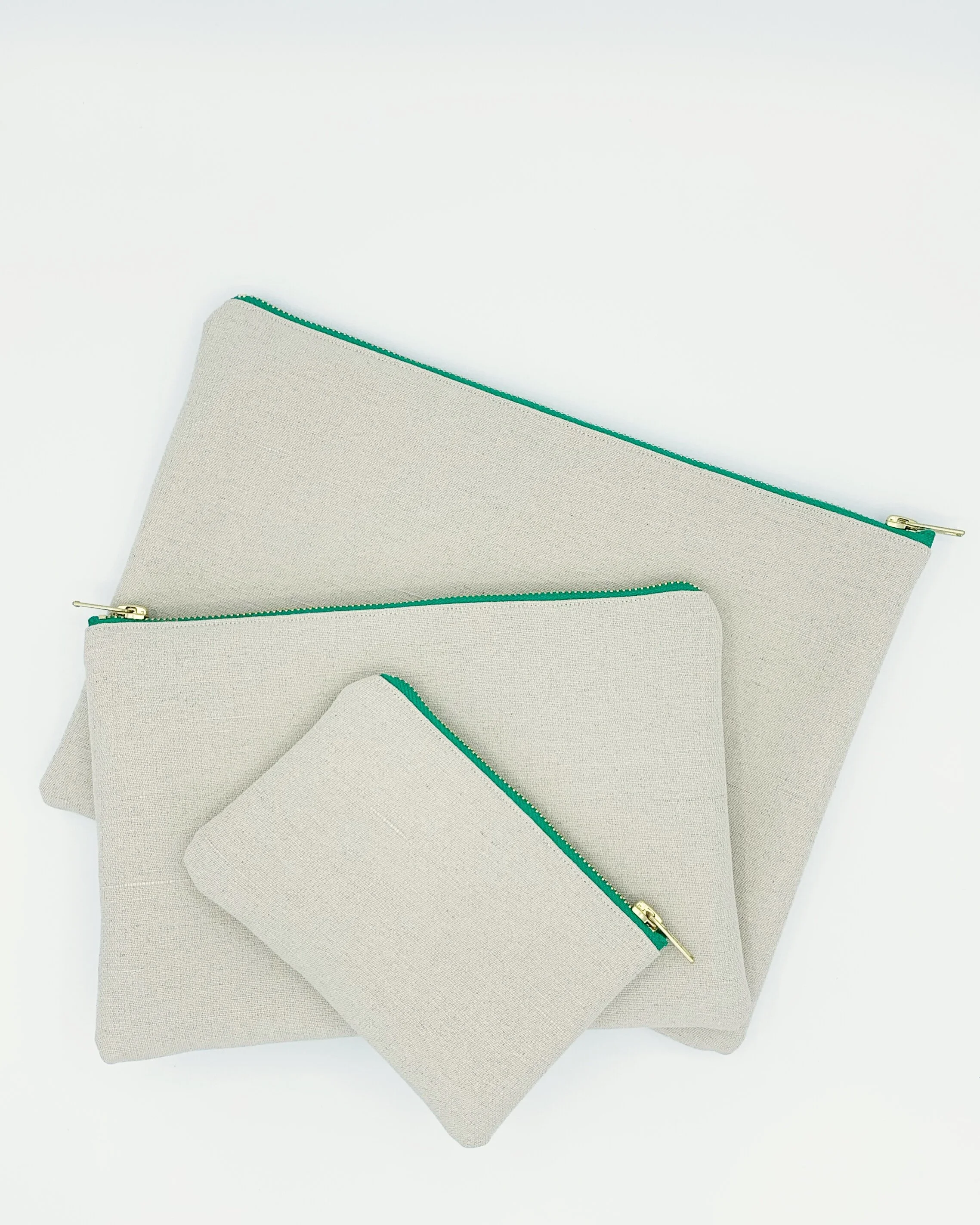 Eliza Eliza Equality Collection cream organic hemp cotton clutch bags and purse green zip on white background