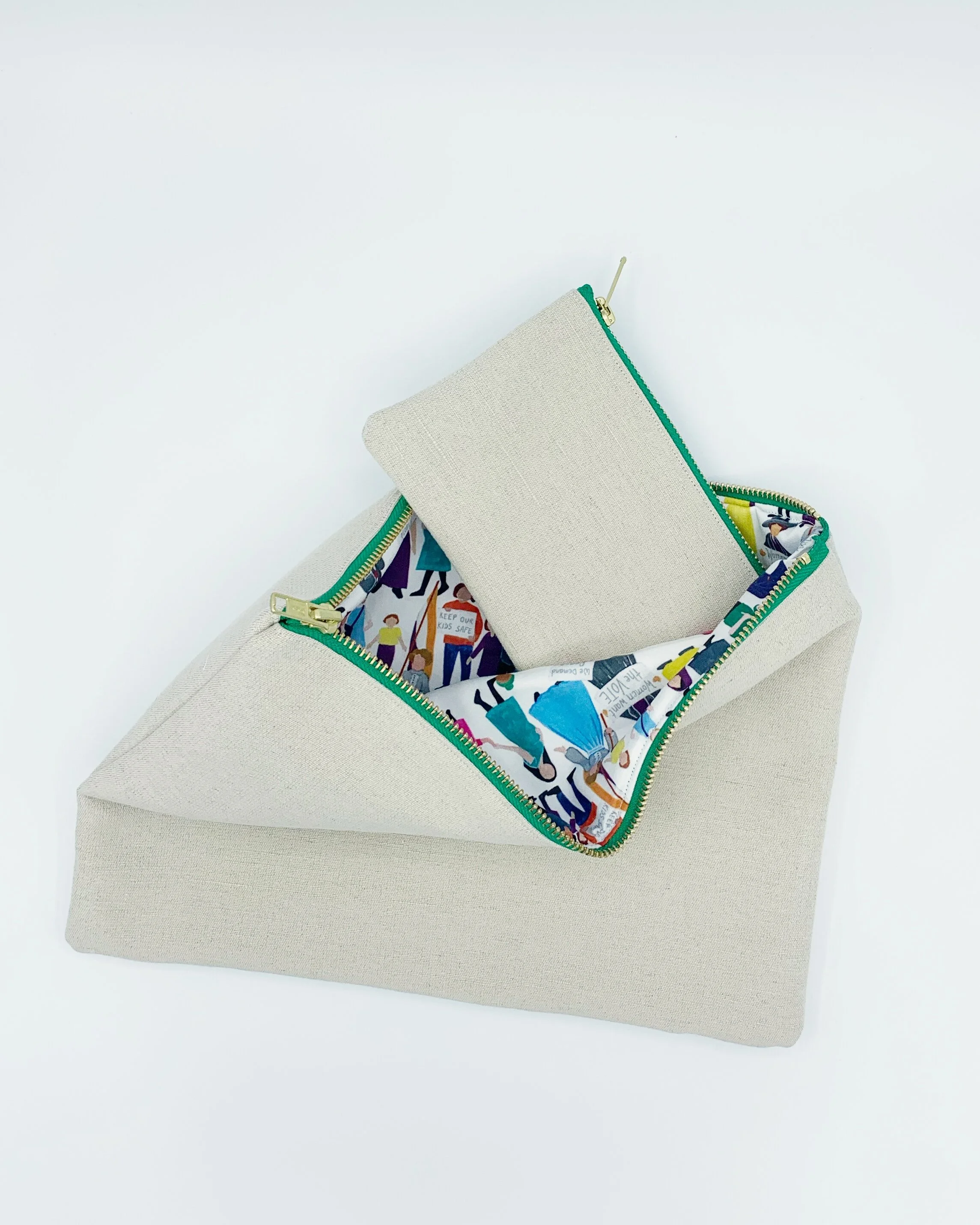 Equality Collection organic hemp cotton cream open clutch bag with purse poking out on white background