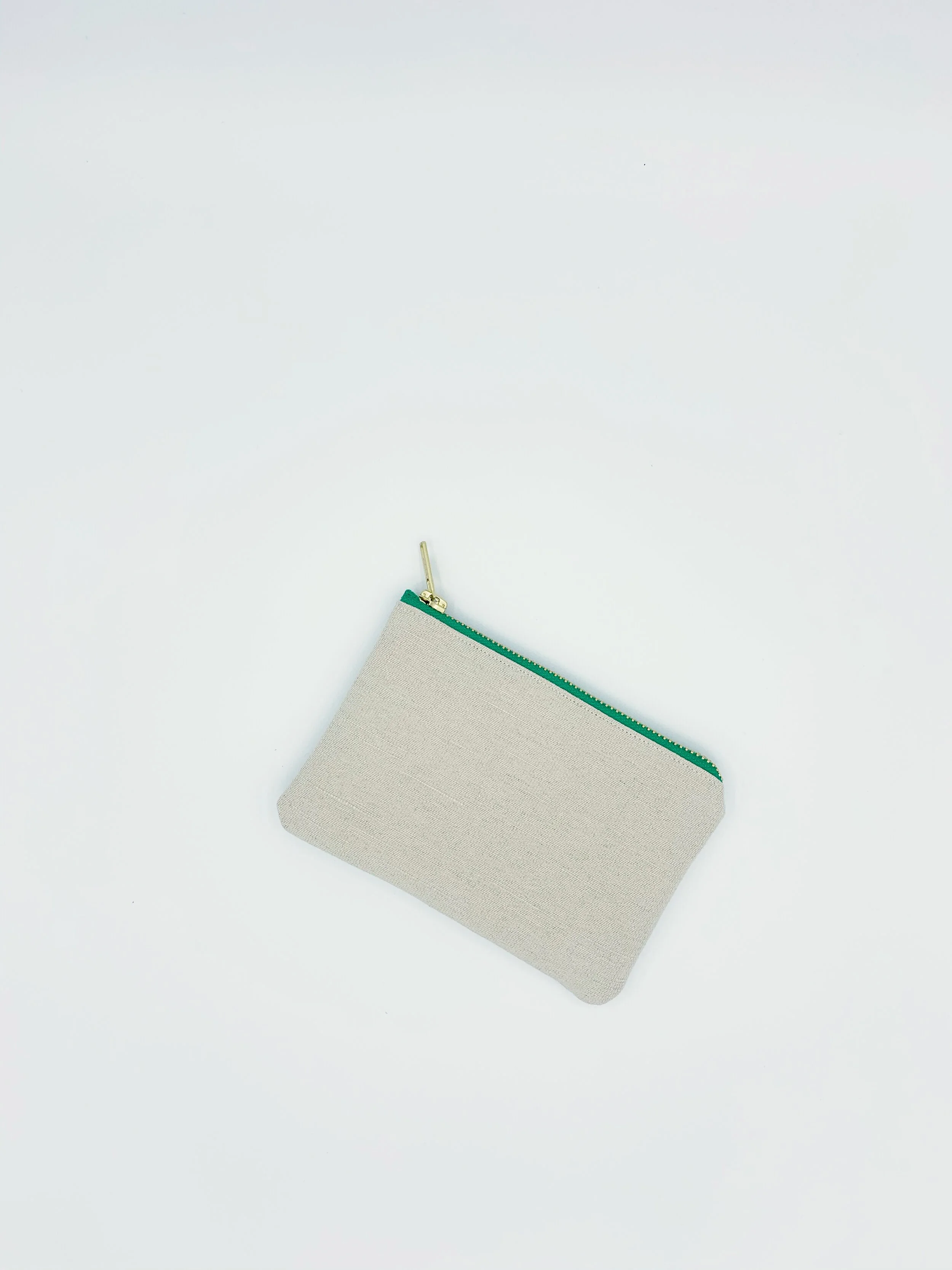 Cream hemp cotton green zip Equality collection purse on white background