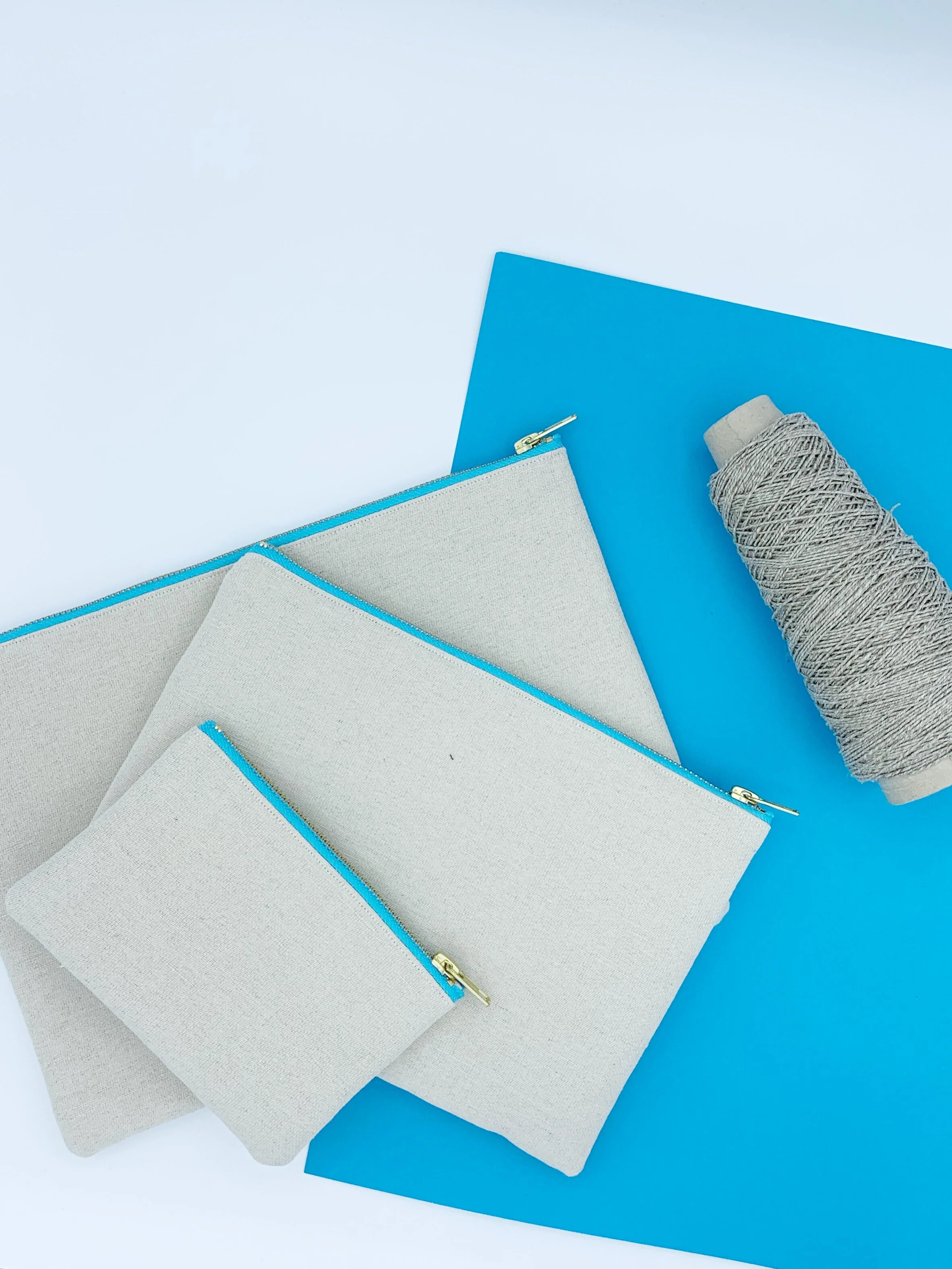 Flat lay of Organic hemp cotton B Collection clutch bags and purse  with hemp yarn