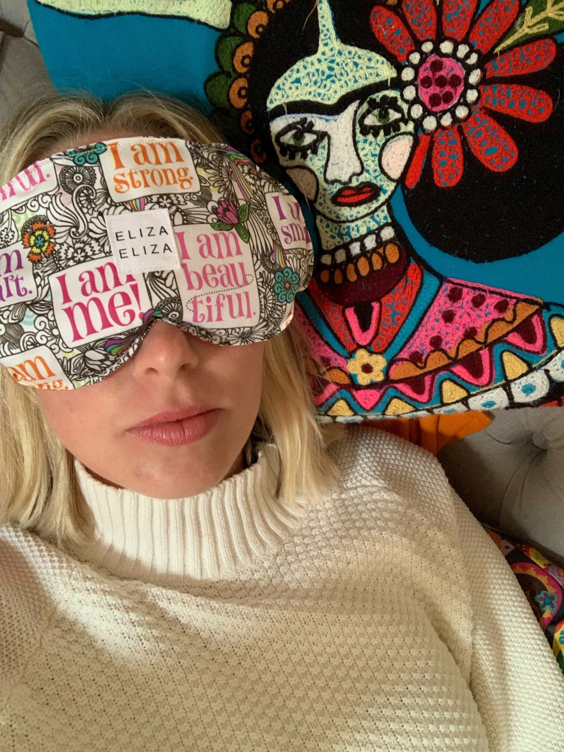 Elizabeth lays down with I am Me organic cotton lavender flax seed eye pillow over her eyes