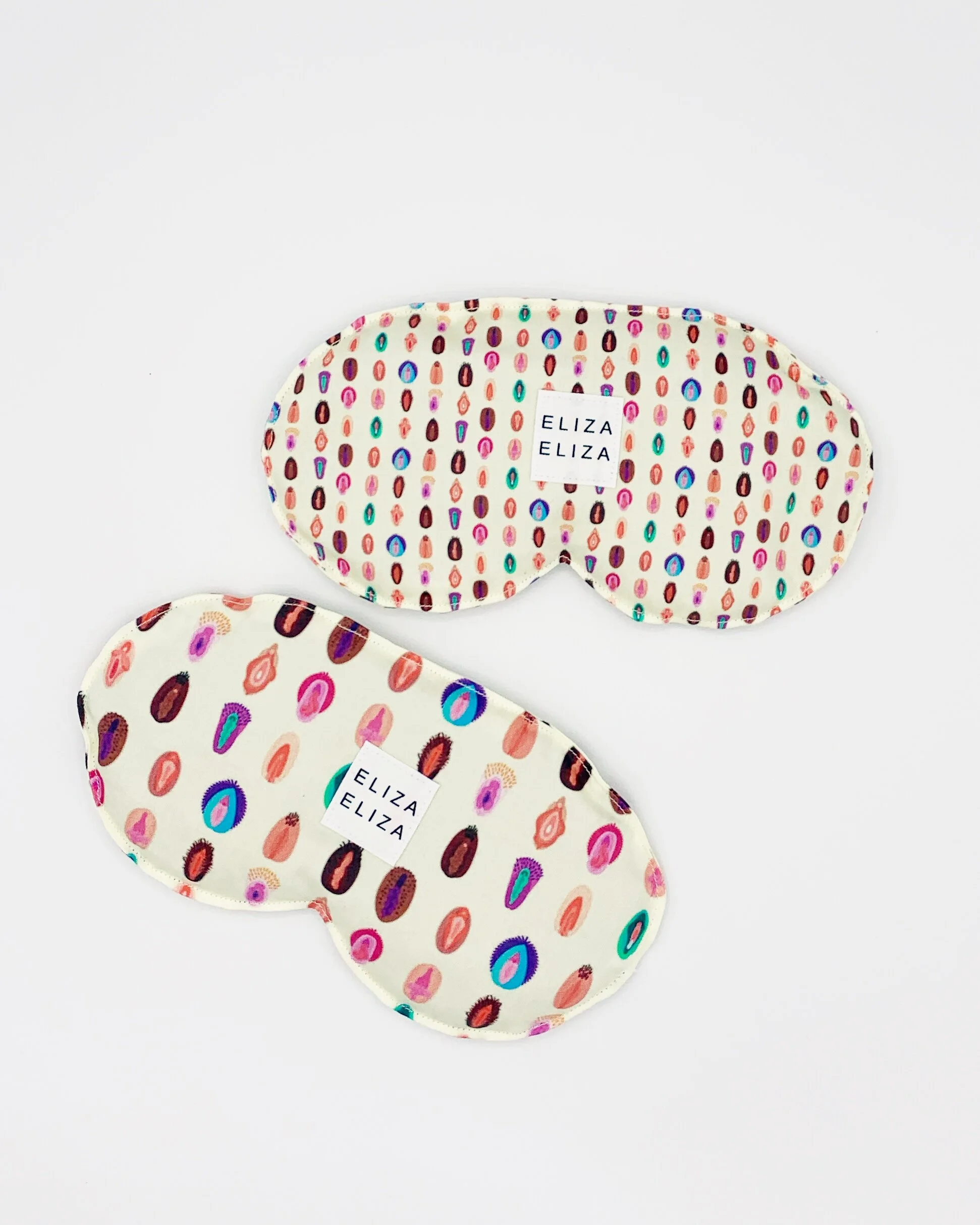 two organic cotton lavender flaxseed V Collection eye pillows on white background