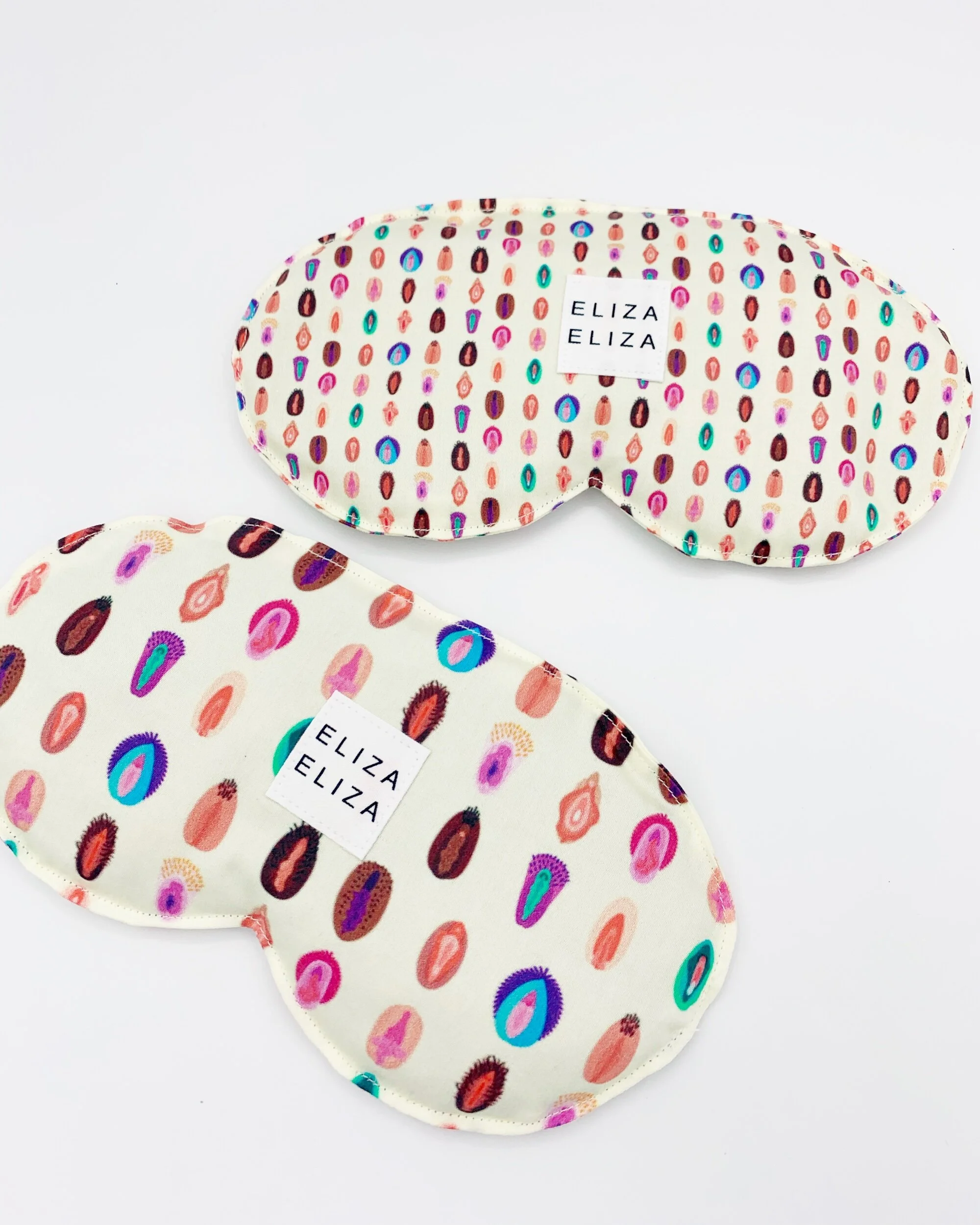 two organic cotton lavender flaxseed V Collection eye pillows on white background