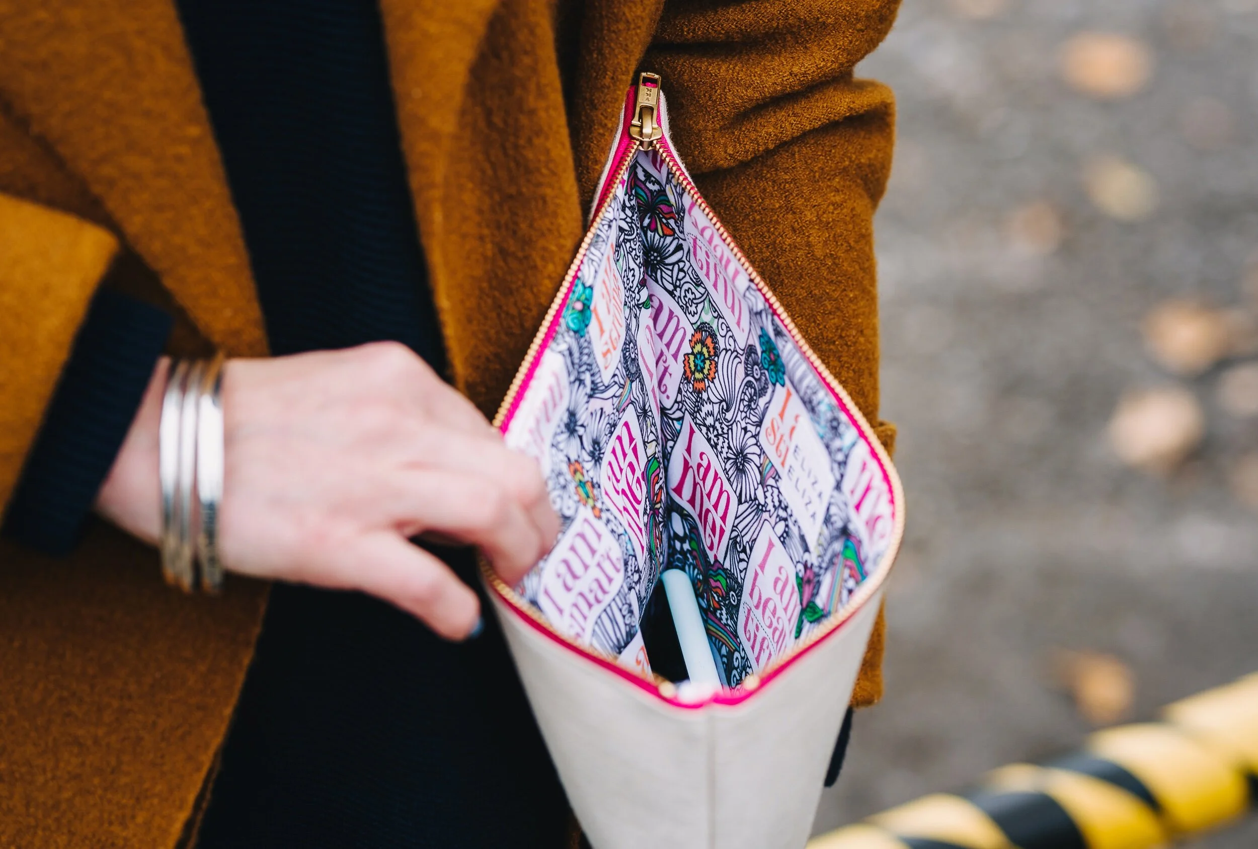 Woman holds open Large clutch bag I am Me Eliza Eliza