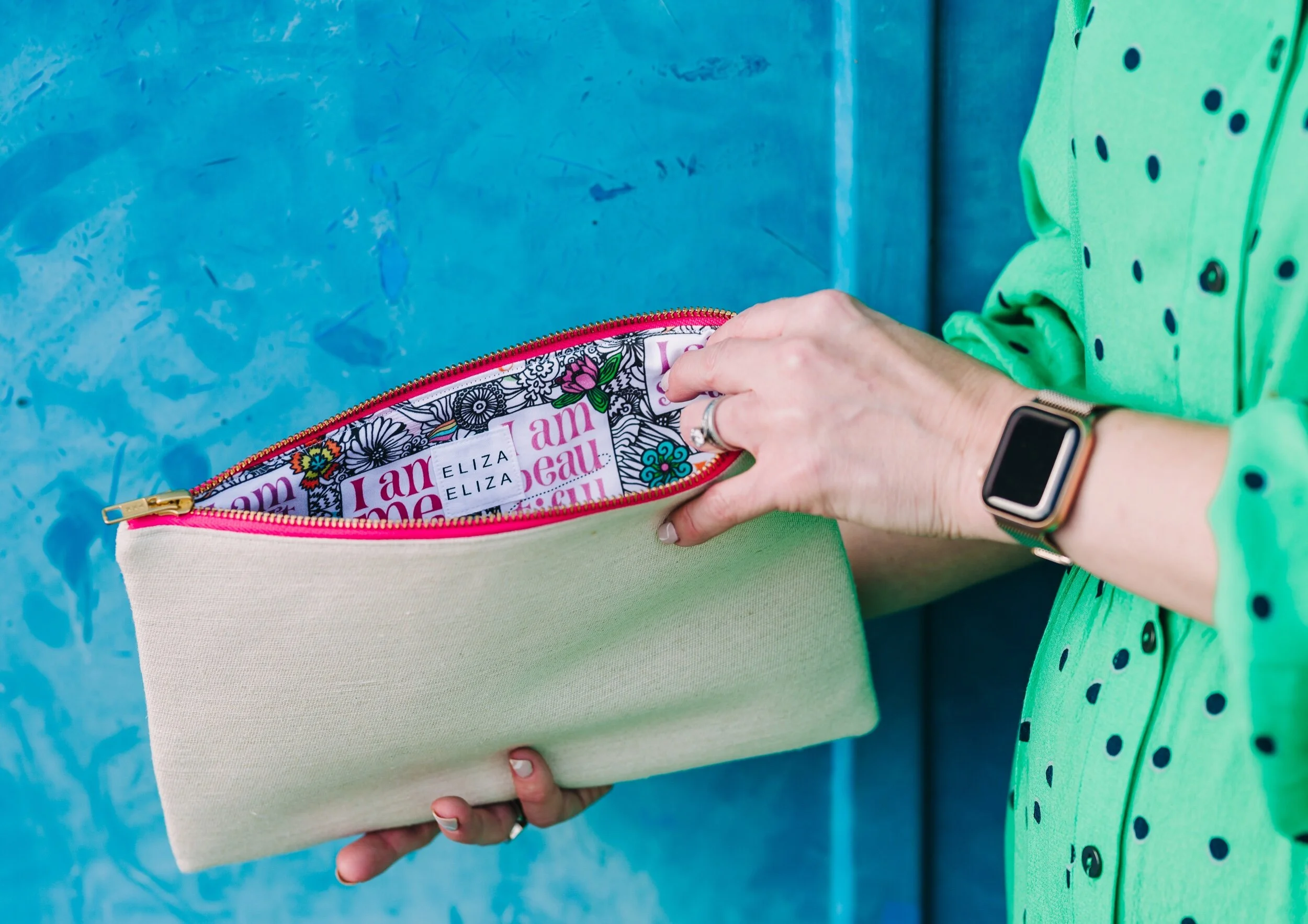 I am me clutch bag being held open by woman wearing green dress mental health awareness