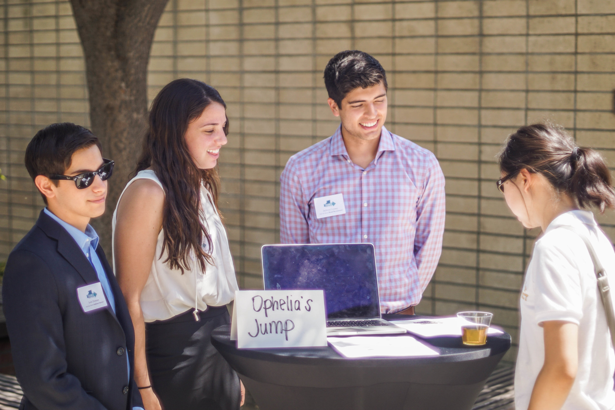  Photo of SOURCE students interacting with guests at the Annual SOURCE Symposium  