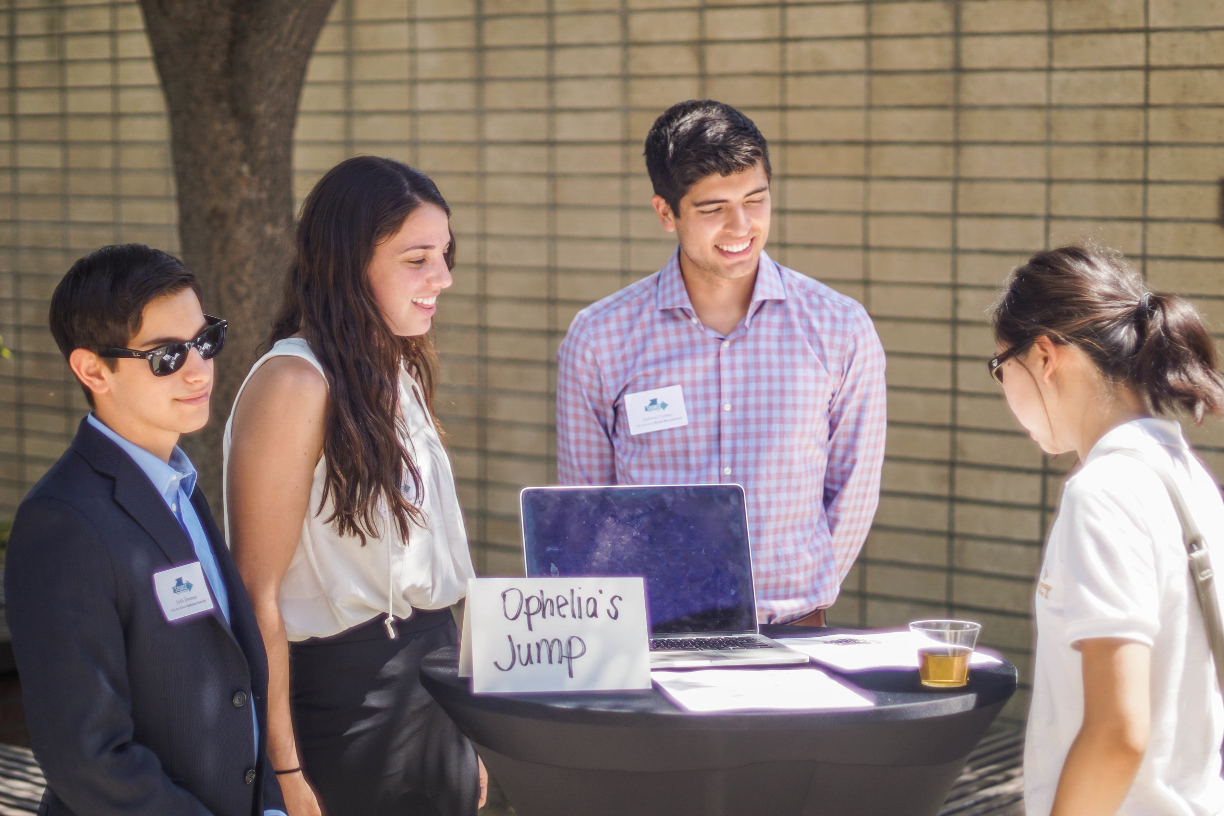 Photo of SOURCE students interacting with guests at the Annual SOURCE Symposium