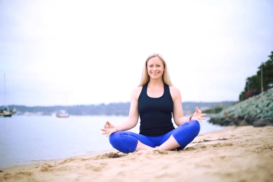 Mary Susan in San Diego in Sukhasana smiling with eyes open.jpg