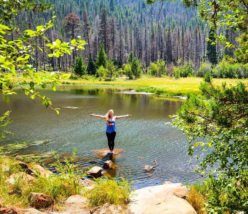 Mary Susan in Tadasana with arms out to sides, CO love tank in RMNP.jpg