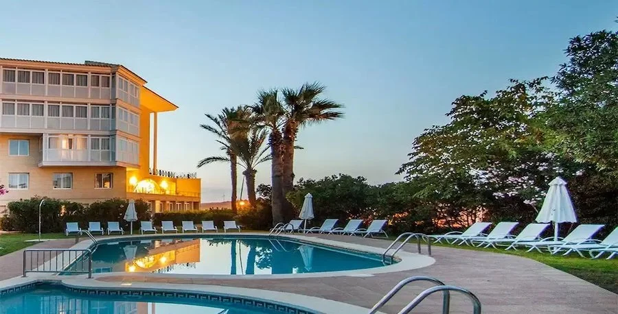 menorca retreat - catalonia mridaor de port hotel pool view with sunset .jpeg