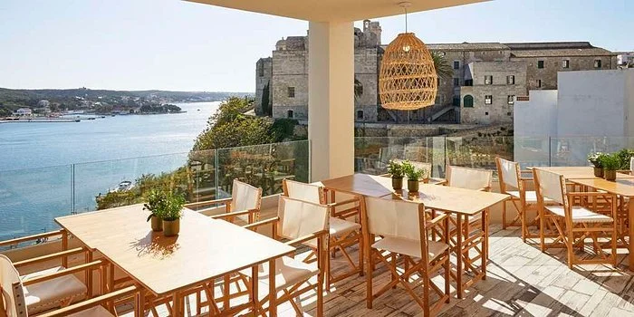 menrorca retreat - catalonia-mirador-des- dining tables with view on patio .jpeg