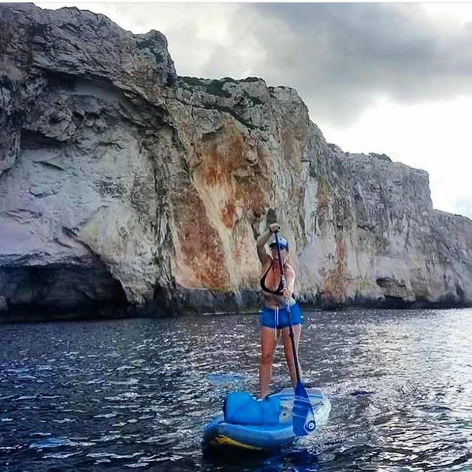 mary stults suping in spain on coast in menorca.jpeg