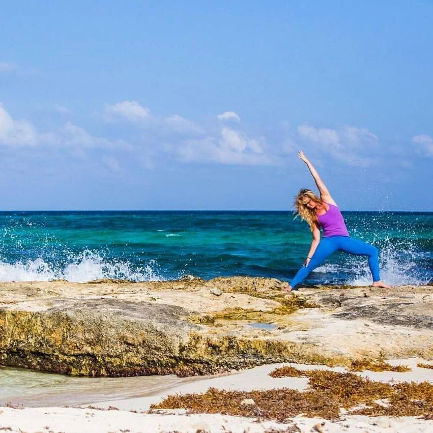 mary stults in blue and purple on rock in mexico in reserve warrior .jpeg