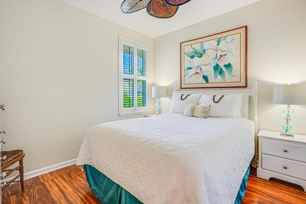 nihilani 2nd qn bedroom shot with turqoise ruffle.jpeg