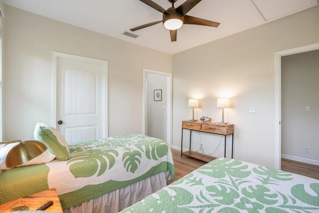 Nihilani Twin room with green and white bedspread.jpeg