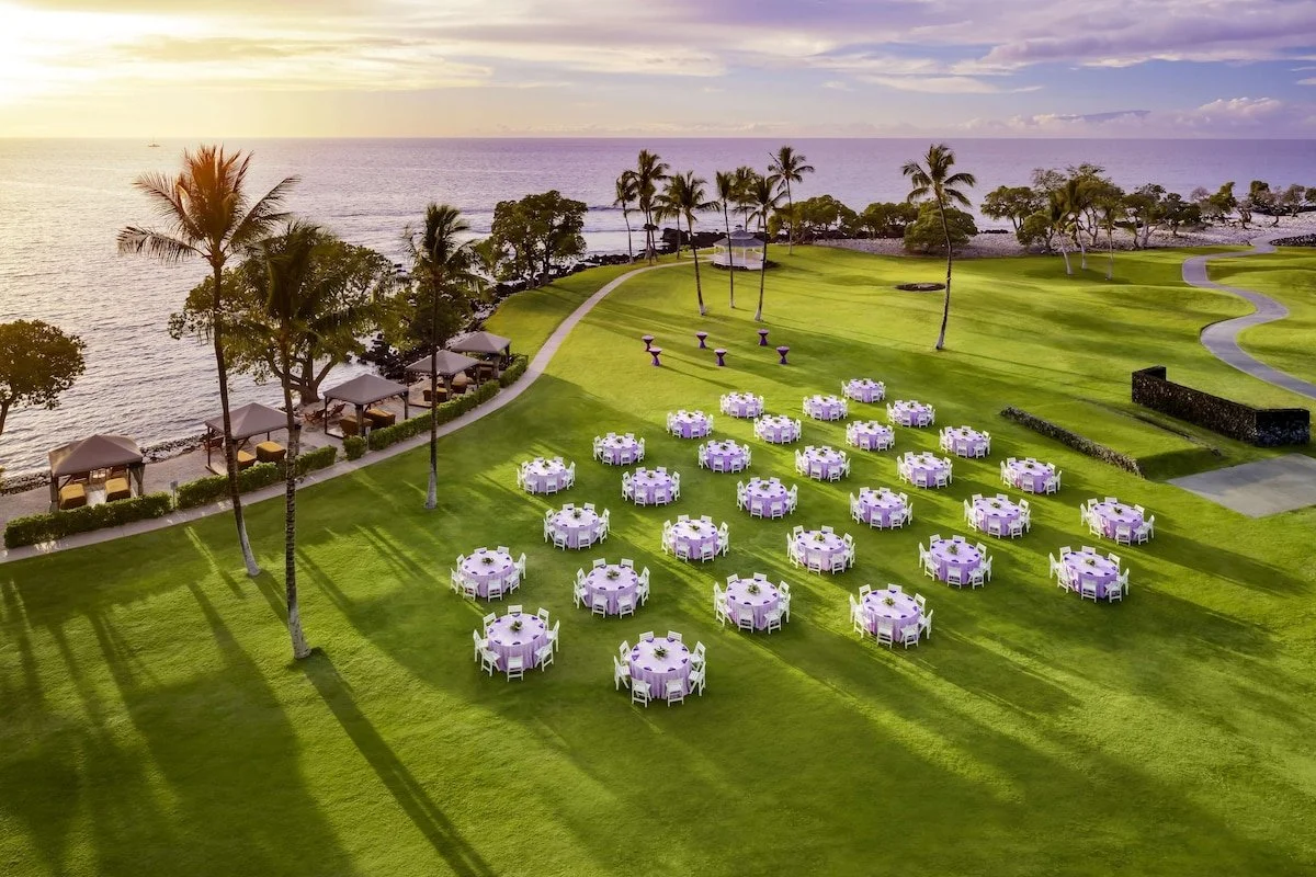 Big Island Fairmont Orchid Hotel - table on green lawn aerial shot .jpeg