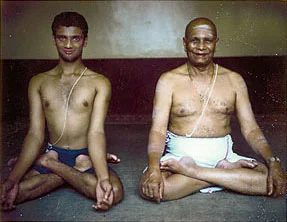 R. Sharath Jois and Sri K. Pattabhi Jois in Mysore, in 1997. This was one of the early test photos taken for the English edition of Yoga Mala by Sri K. Pattabhi Jois. Photo by Stephan Crasneanscki / Used with permission: Eddie Stern