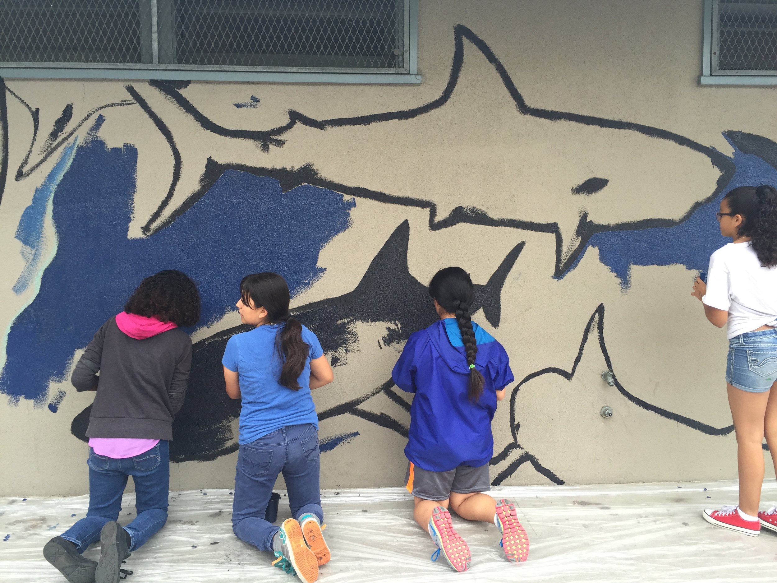 Kids painting the shark mural 1