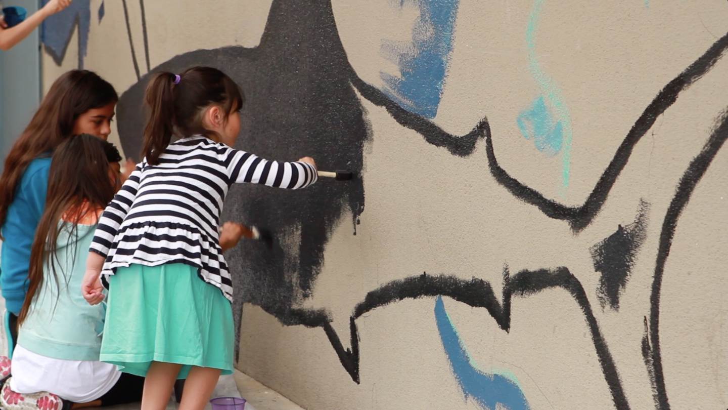 Kids painting the shark mural 2