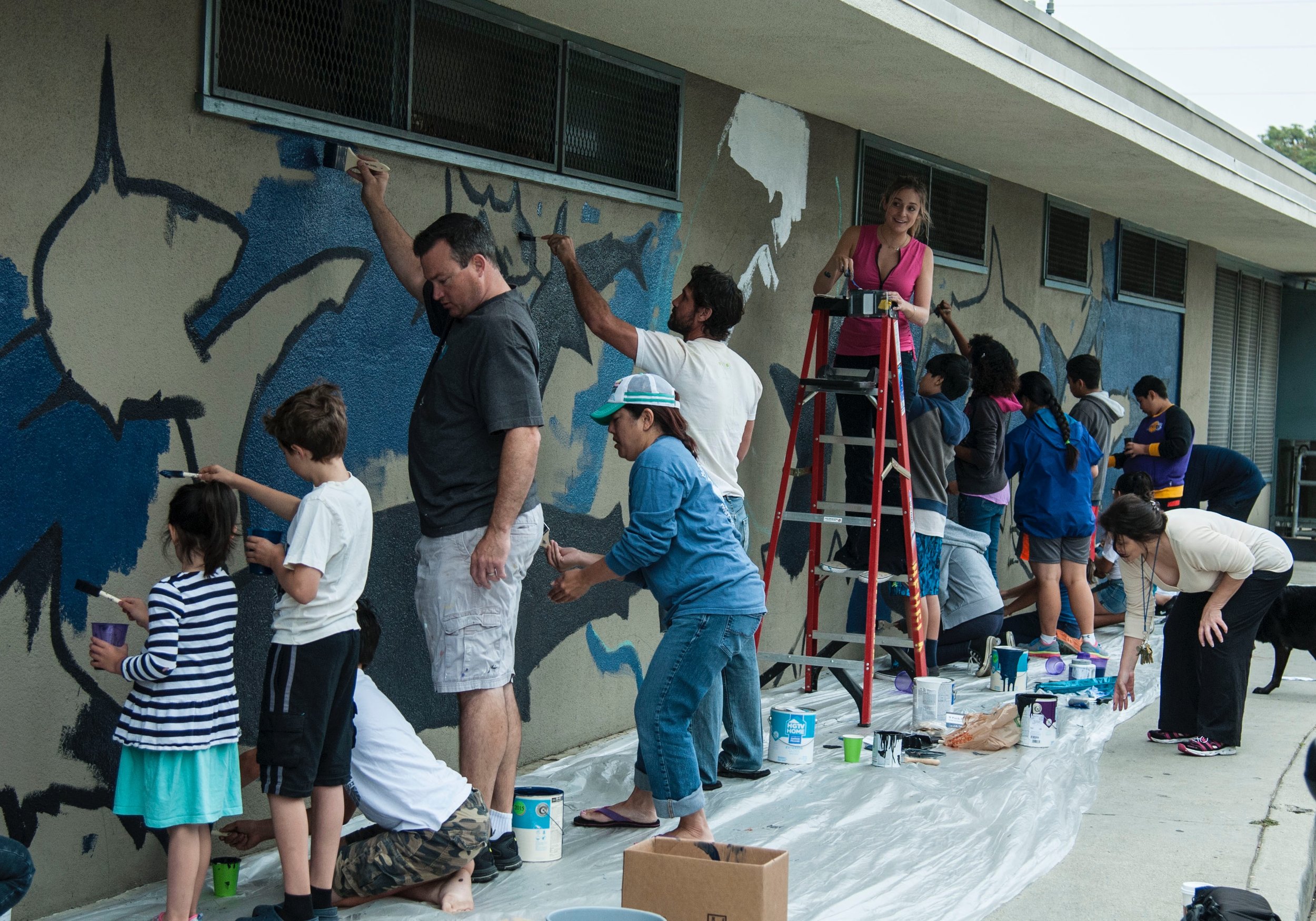 Kids painting the shark mural 7