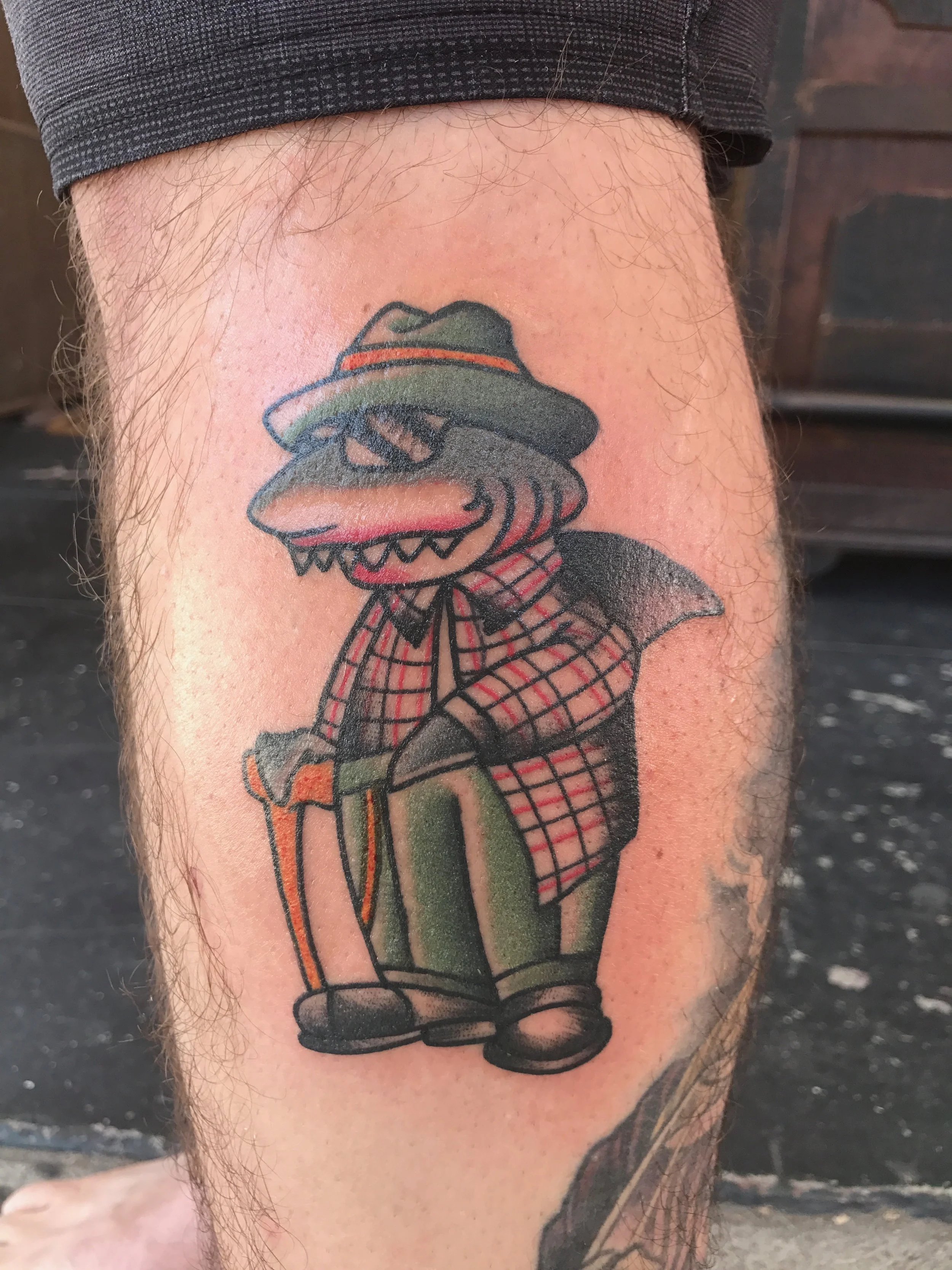 Shark suit tattoo