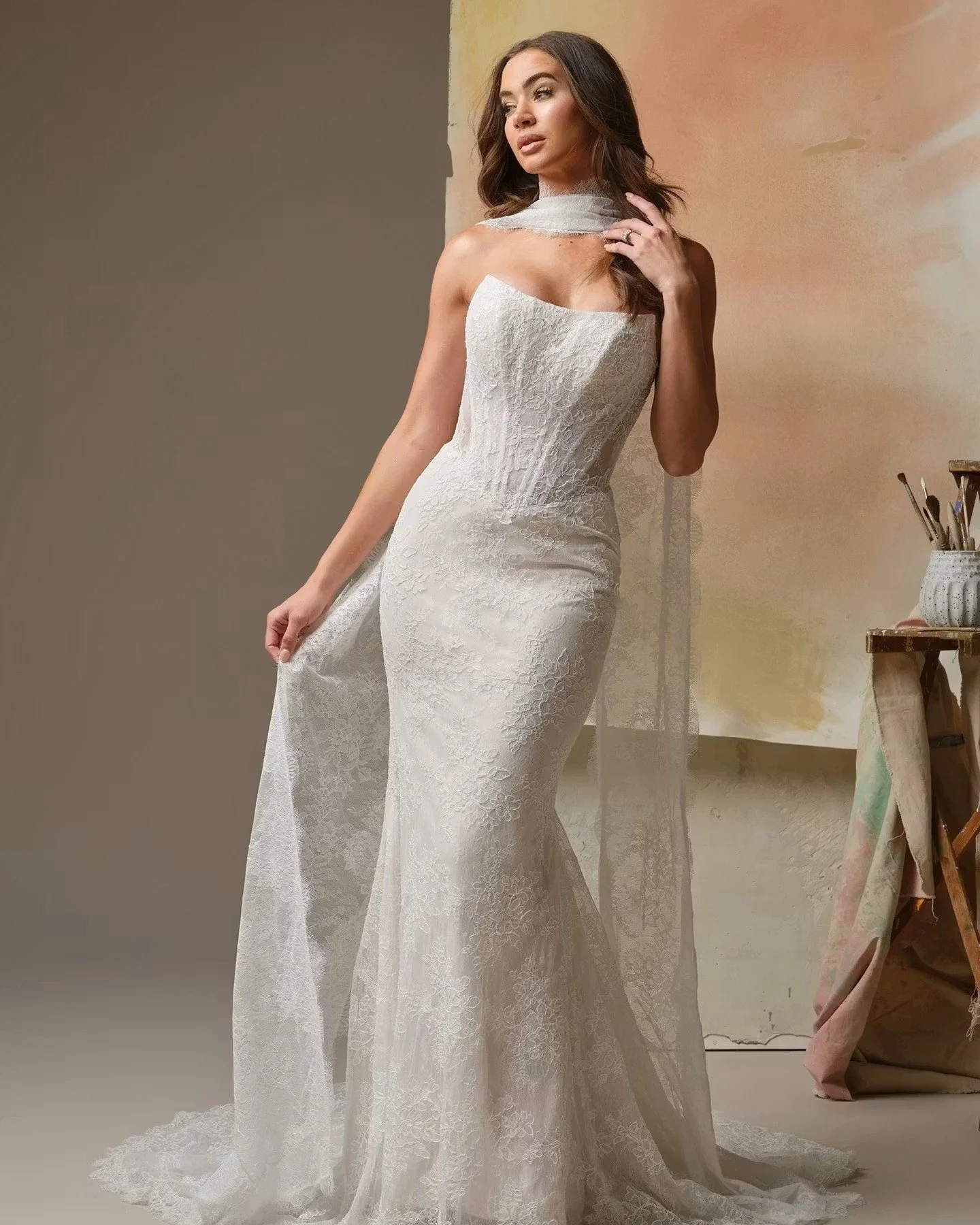 A R I A D N E  by Maggie Sottero 🤍🤍🤍
...
This unembellished Chantilly lace cat eye wedding dress is pure elegance, but it's also a little extra with the matching scarf and/or the sleeves!!! 😍 If you love the glamour, this dress is for you! Also a
