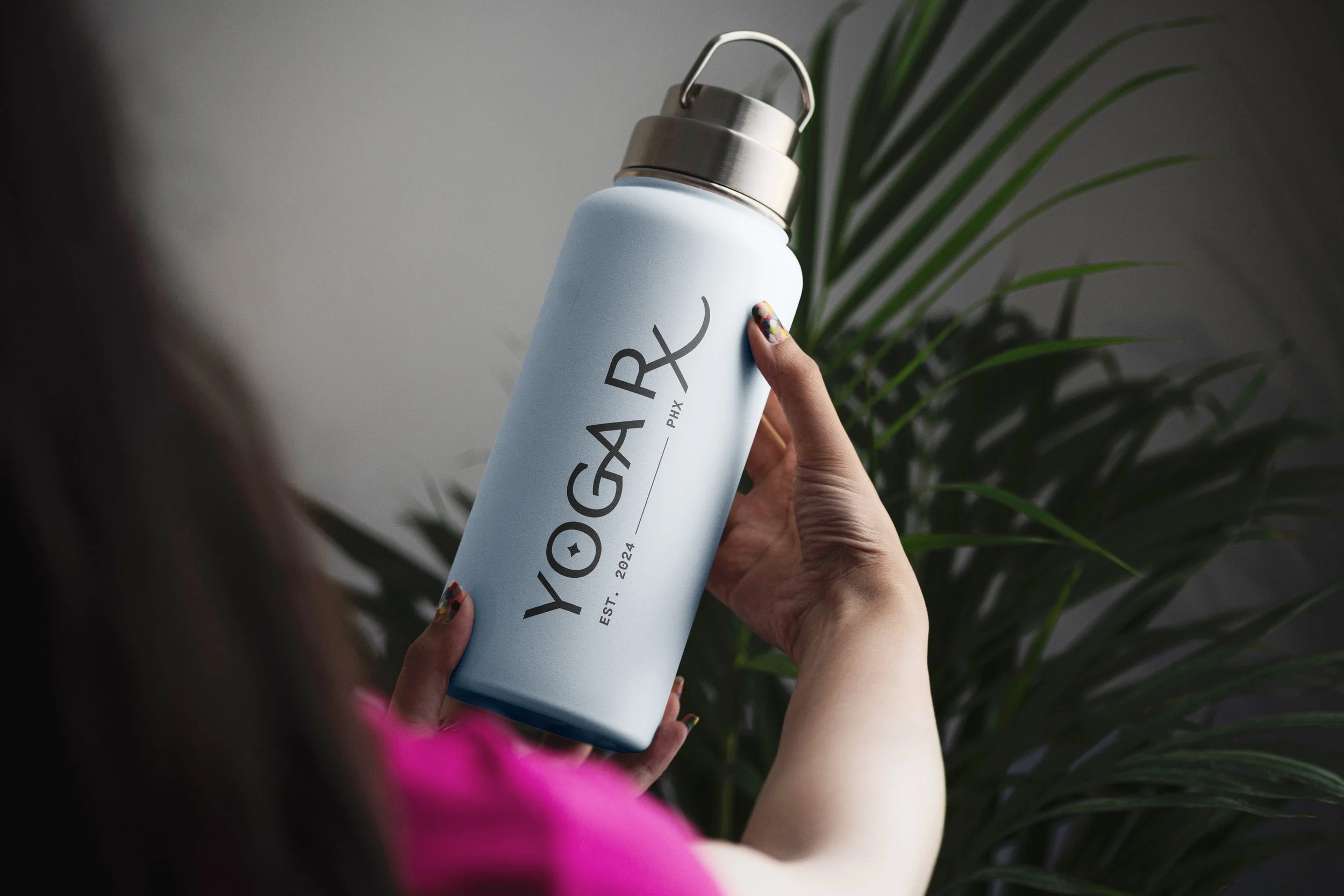  Woman Holding Bottle Mockup.jpg