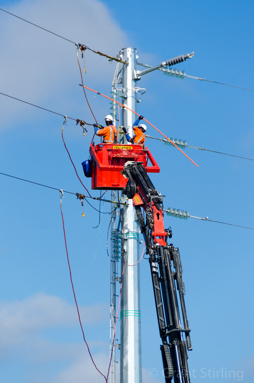 Linesman connecting powerlines