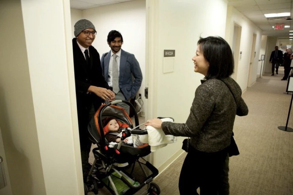 Del. Kathy Tran (D-Fairfax) chats with legislative assistants Rodrigo Velasquez, left, and Adi Radhakrishnan. (Timothy C. Wright for the Washington Post)