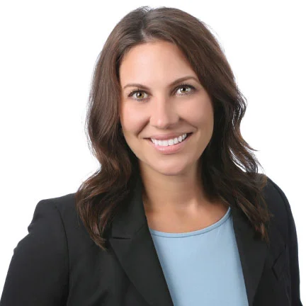 Young professional attorney, female, professional head shot, smiling.
