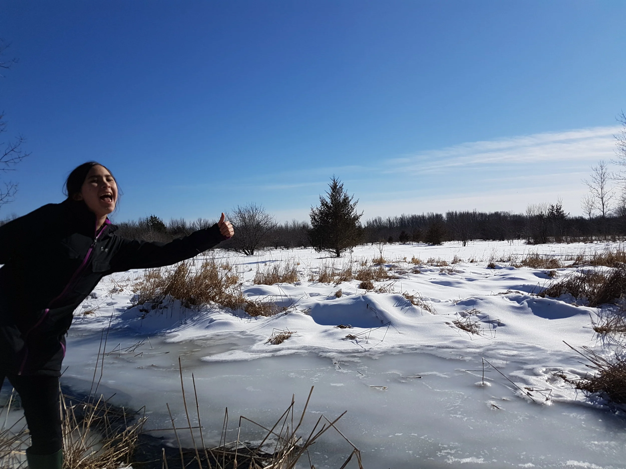 Trying to convince me that it's ok to cross...weighing out shortest route vs. wrath of mom....