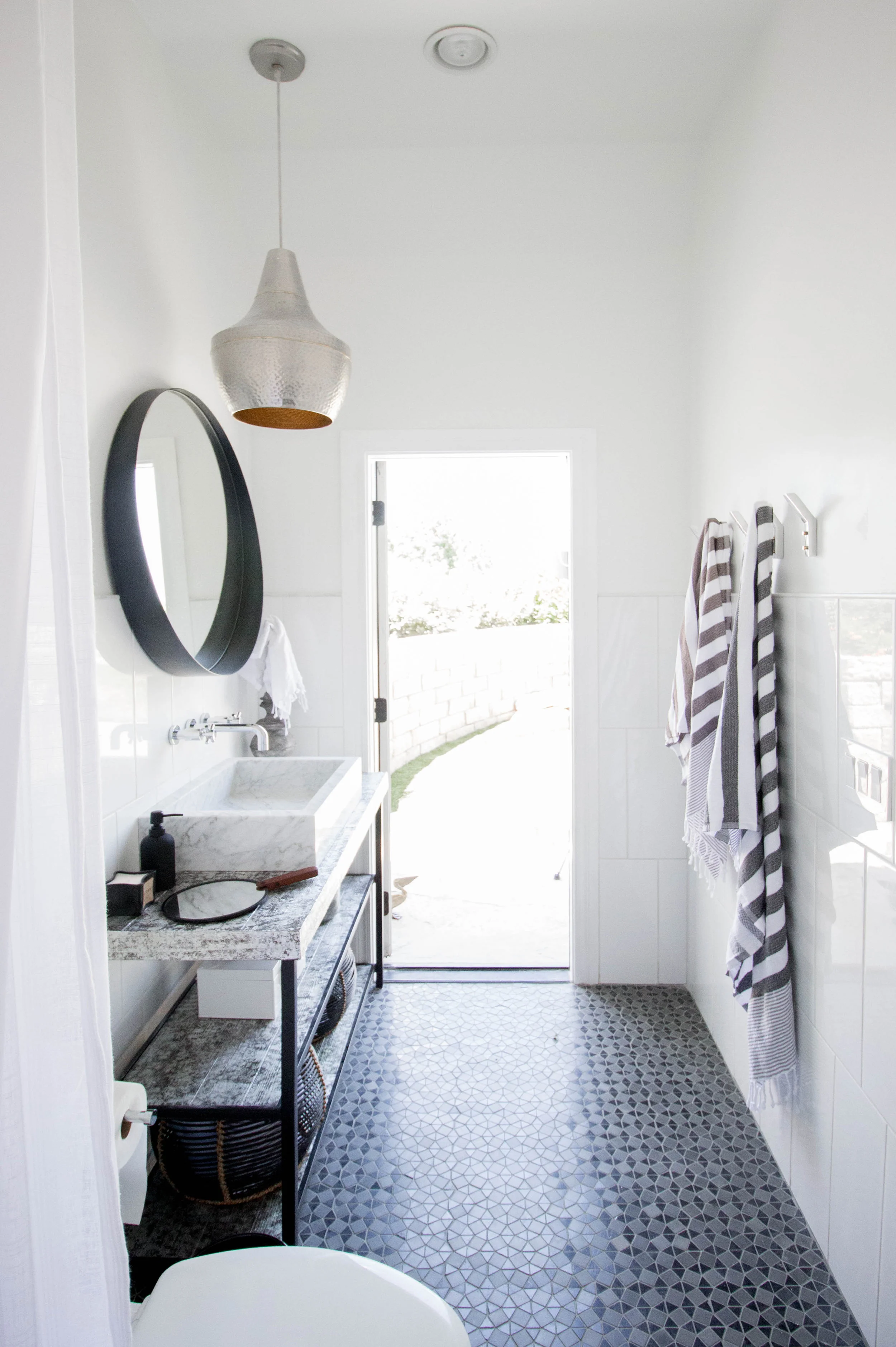 KOA HOUSE_pool bathroom gatsby tile white cb2 crescent mirror hammered silver pendant custom vanity silver leaf 2.jpg