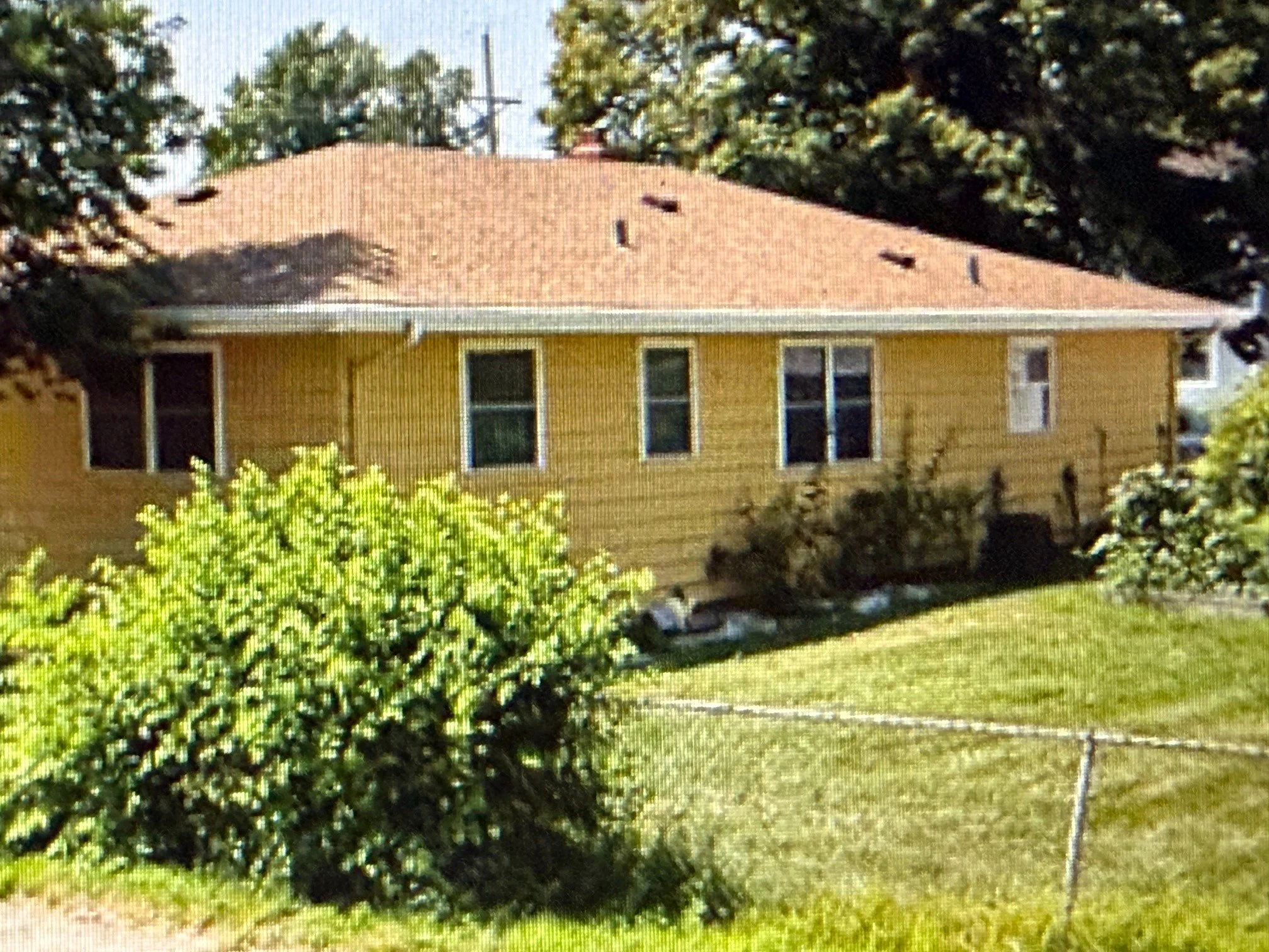 Original tan siding and roof before the Omaha exterior restoration project
