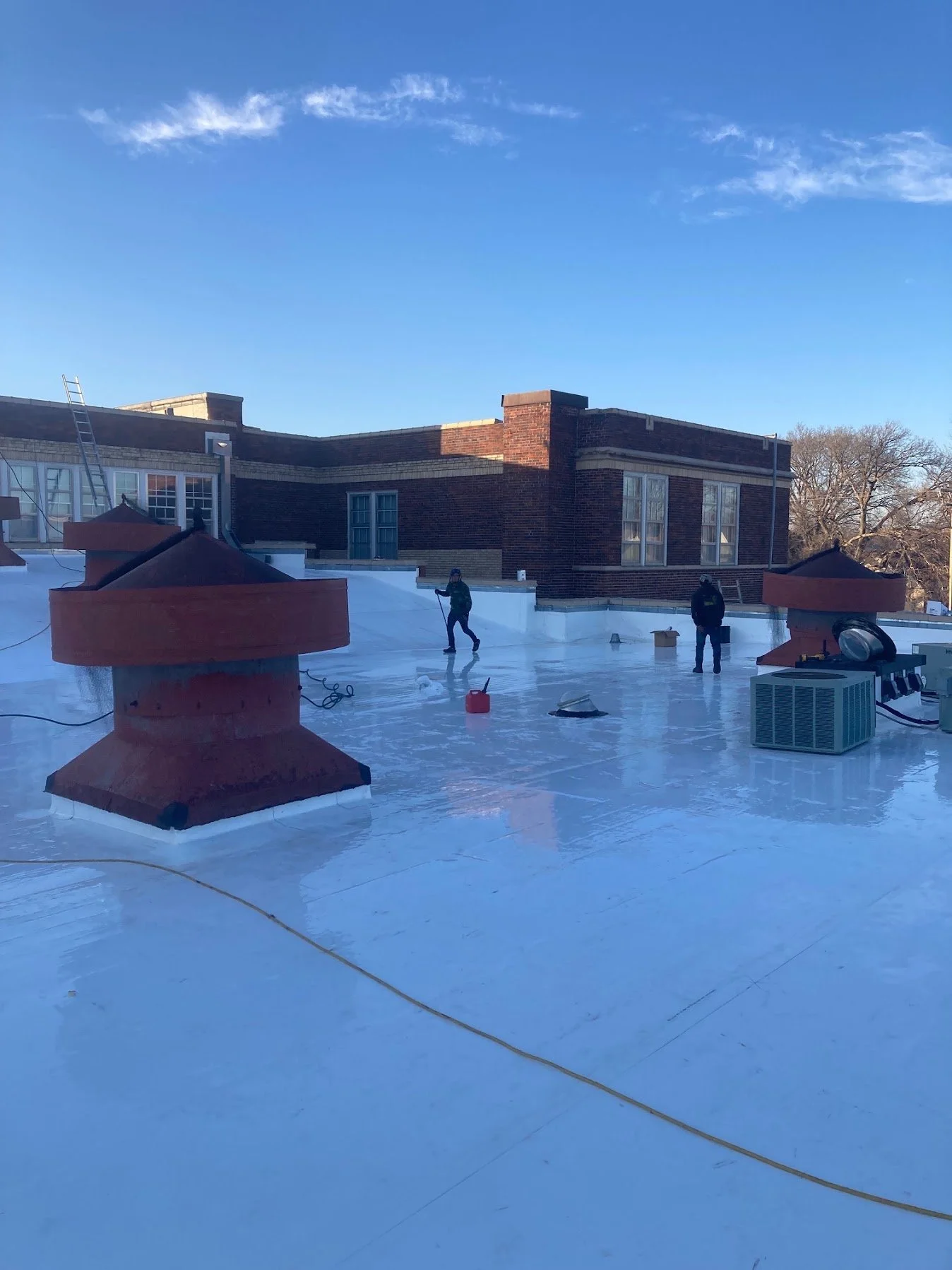 Commercial flat-roof work scene from the Midwest Restorations project photo archive