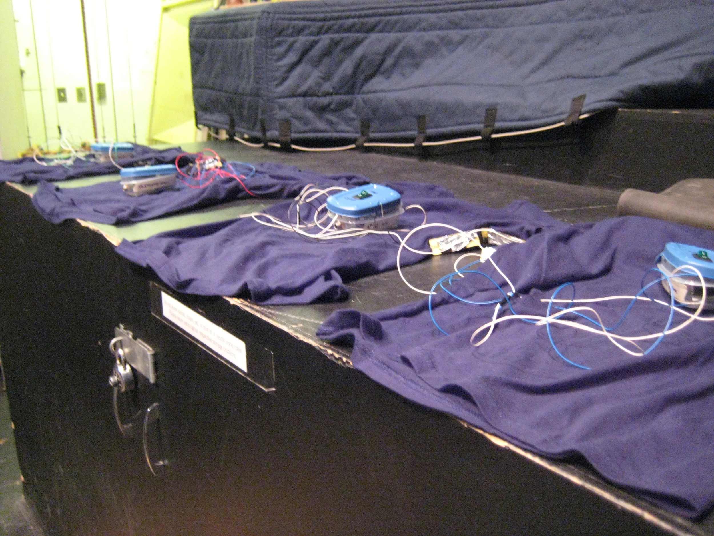 The noise-shirts were my first adventure into the world of interactive electronics. Similar to the Venomous Gloves, the noise-shirts contain circuits made-up of bent amplifier circuits that produce a multitude of sounds based on their configuration. Instead of being activated through skin contact though, they react to the sensors being touched to each other. To accommodate this, I decided to place the sensors in the arm-pits of the shirts, so that when the musician moves their body to play their instrument, they inadvertently activate the circuit. Although I’ve used this instrument for a multitude of performances, my personal favourite was for my Saxophone Quartet Re-Ordered Chaos premiered at the NuMusic at NextFest in Edmonton, which can be seen here: