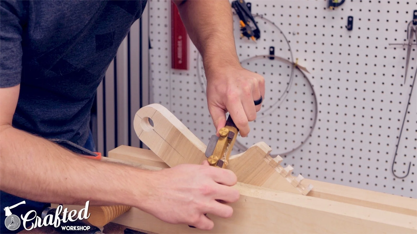 chamfering the edges of a piece of maple using a spokeshave