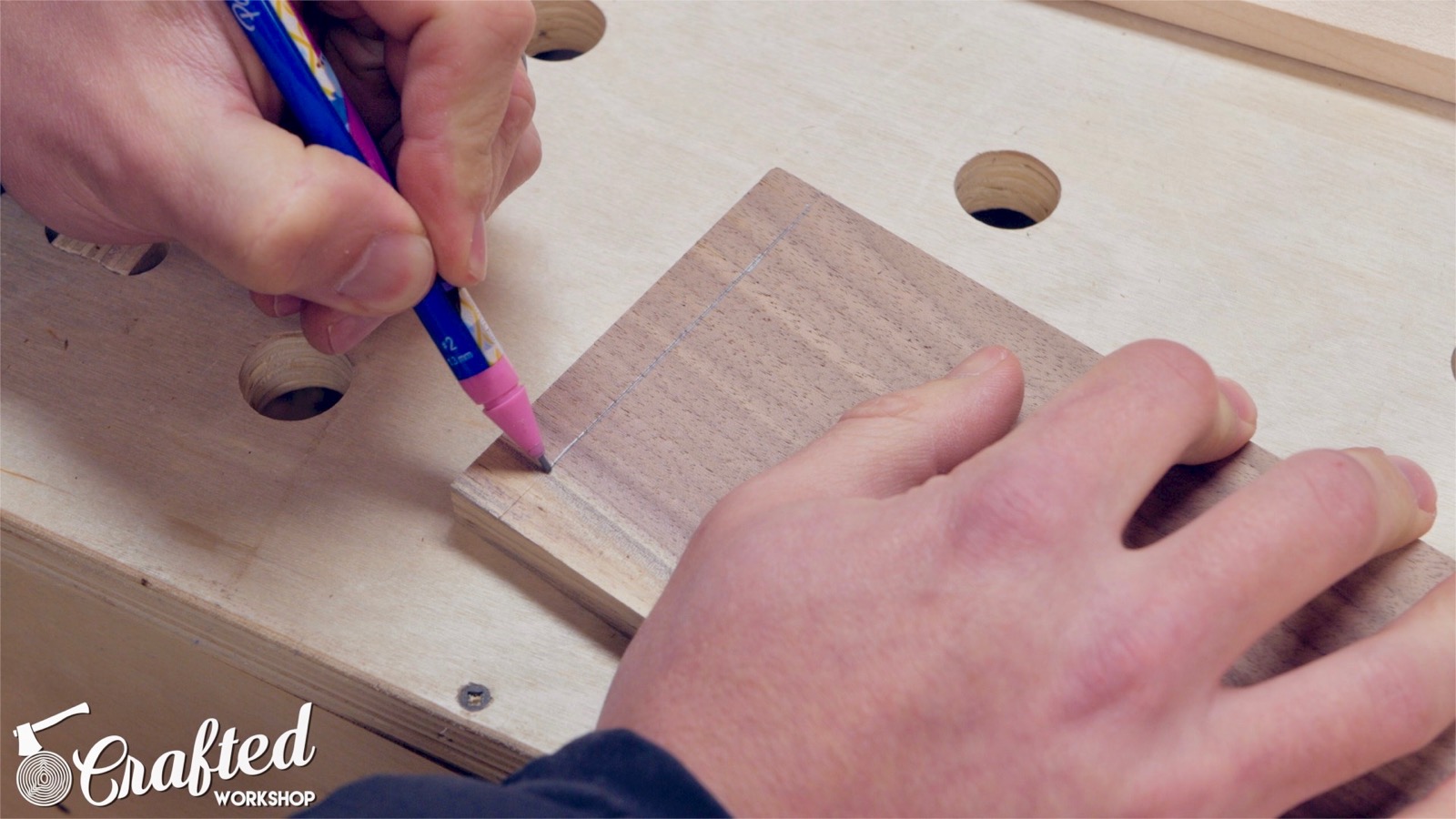 tracing marking gauge line on walnut before cutting dovetails