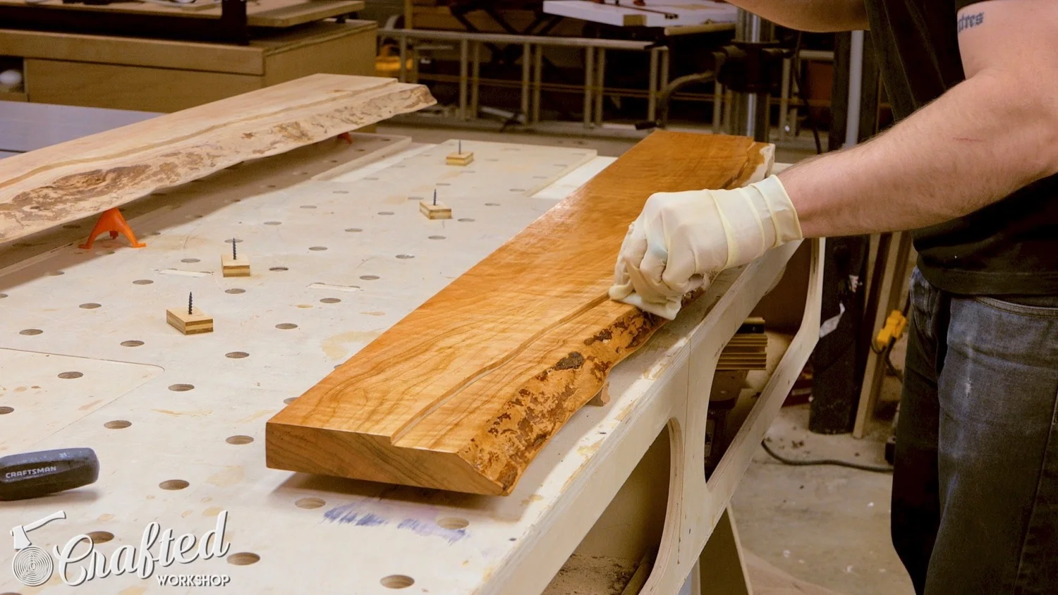 applying minwax wipe on poly on cherry live edge slab