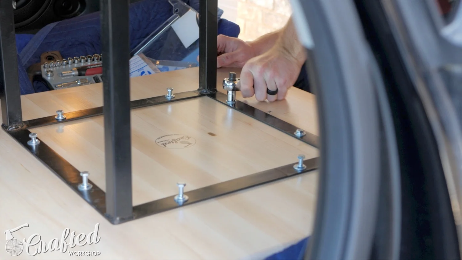 attaching steel table base legs to wood top using threaded holes and bolts