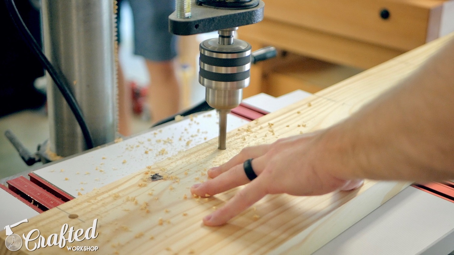 Drilling holes in the breadboard ends of the dowel pins which will go through the Dominos.