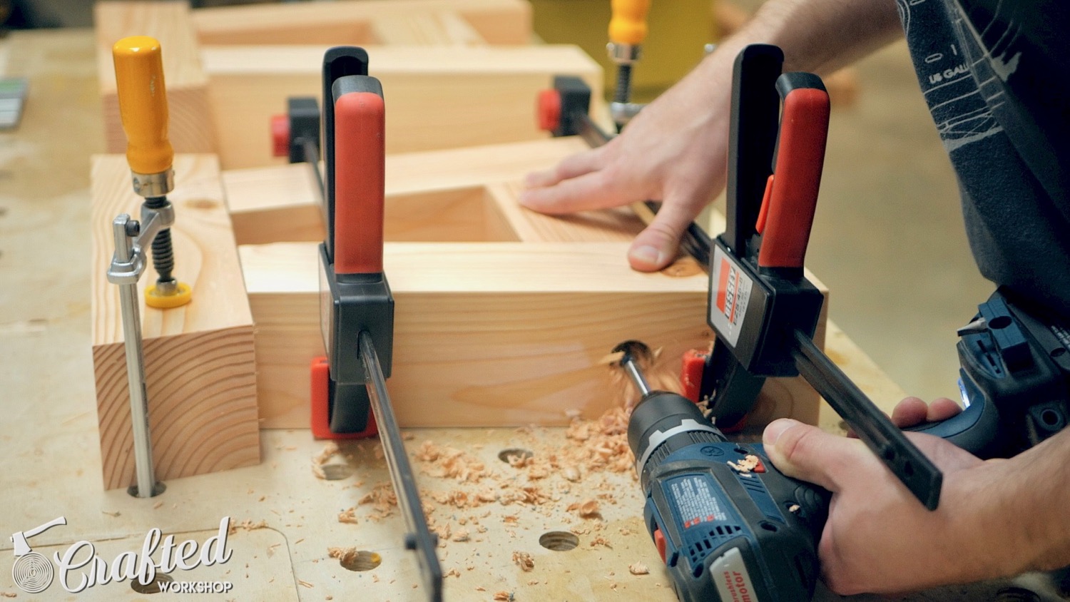 Drilling the holes for the dowels using a 1" spade bit.